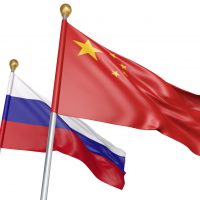 Isolated China and Russia flags flying together for diplomatic talks and trade relations