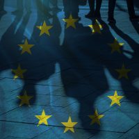 EU Flag and shadows of People concept picture